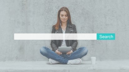 A woman searching for information on a laptop